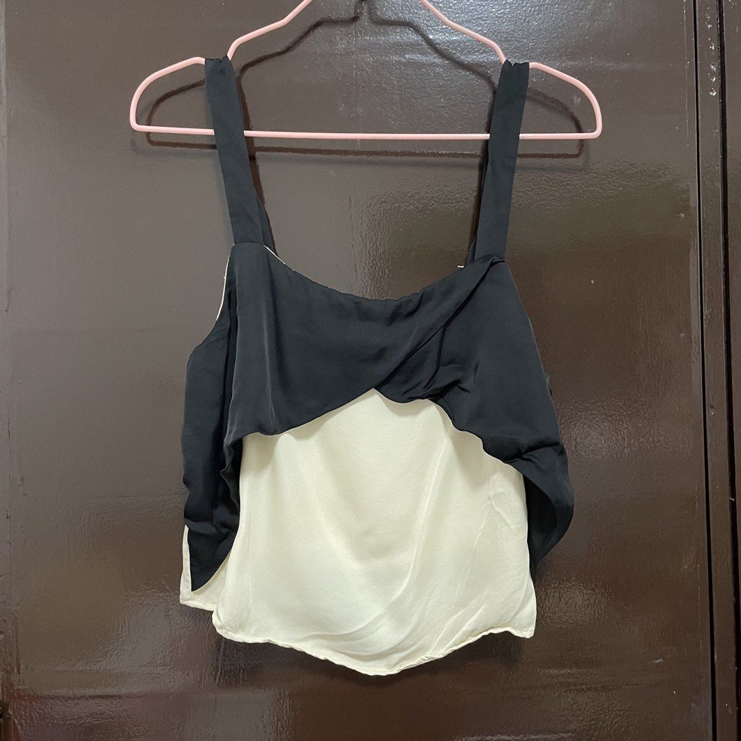 Zara Basic Collection Black and White Camisole Top XS (Category: Sleeveless) located in Pasay City. Submitted by lovedbyzea (Listing ID 1467526119, Image 1). Description: - Brand: Zara Basic Collection - Size: XS - Color: Black and white - Origin: Made in Turkey - Design: Double layered with a black twisted overlay and off-white inner layer - Straps: Adjustable thick straps - Style: Great contrast piece for casual outings or layering.