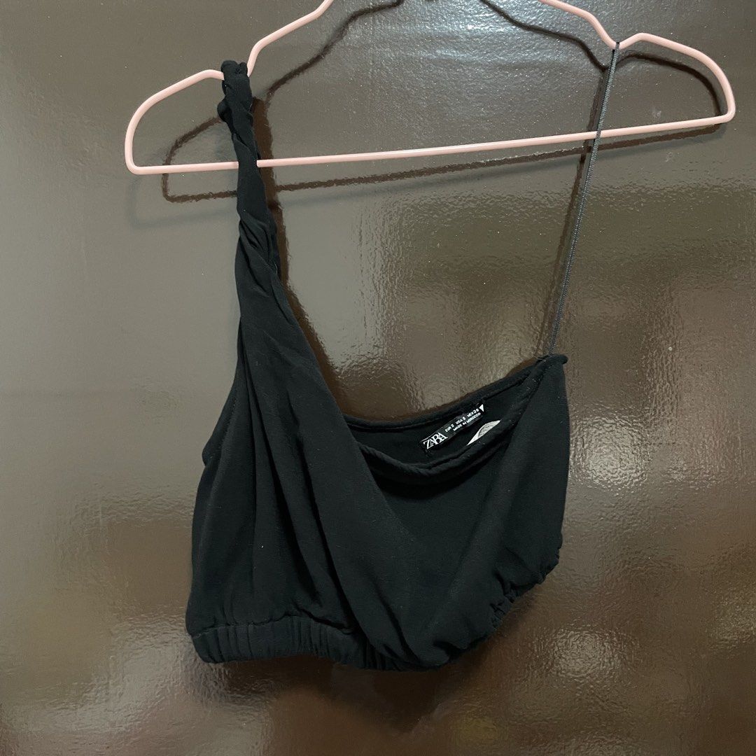 Zara Black One-Shoulder Crop Top Size S (Category: Sleeveless) located in Pasay City. Submitted by lovedbyzea (Listing ID 1467526394, Image 2). Description: - Brand: Zara - Size: S - Color: Black - Design: One-shoulder with one twisted strap and one thin spaghetti strap - Details: Draped front fabric, elasticized hem - Origin: Made in Morocco - Styling tip: Easy to pair with high-waisted jeans or skirts.