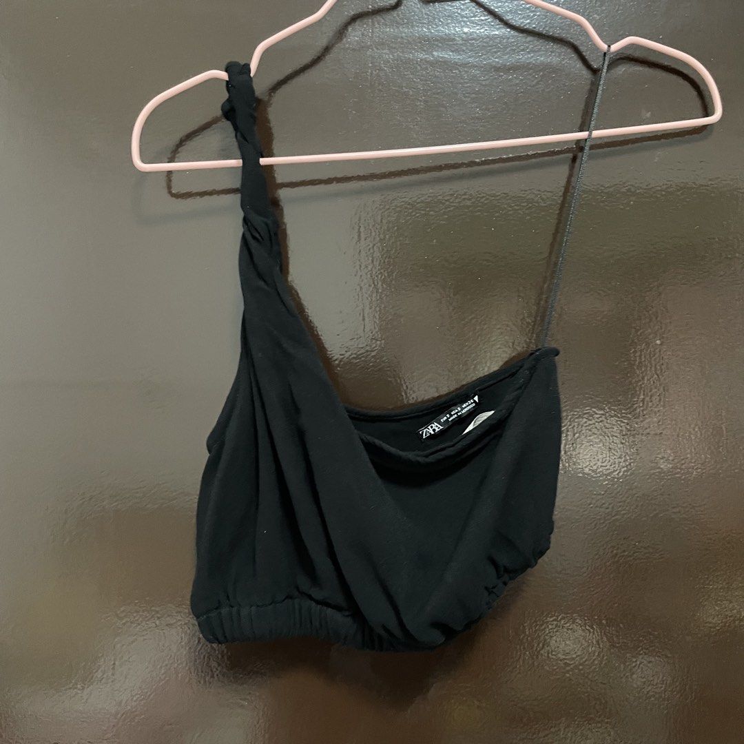 Zara Black One-Shoulder Crop Top Size S (Category: Sleeveless) located in Pasay City. Submitted by lovedbyzea (Listing ID 1467526394, Image 1). Description: - Brand: Zara - Size: S - Color: Black - Design: One-shoulder with one twisted strap and one thin spaghetti strap - Details: Draped front fabric, elasticized hem - Origin: Made in Morocco - Styling tip: Easy to pair with high-waisted jeans or skirts.