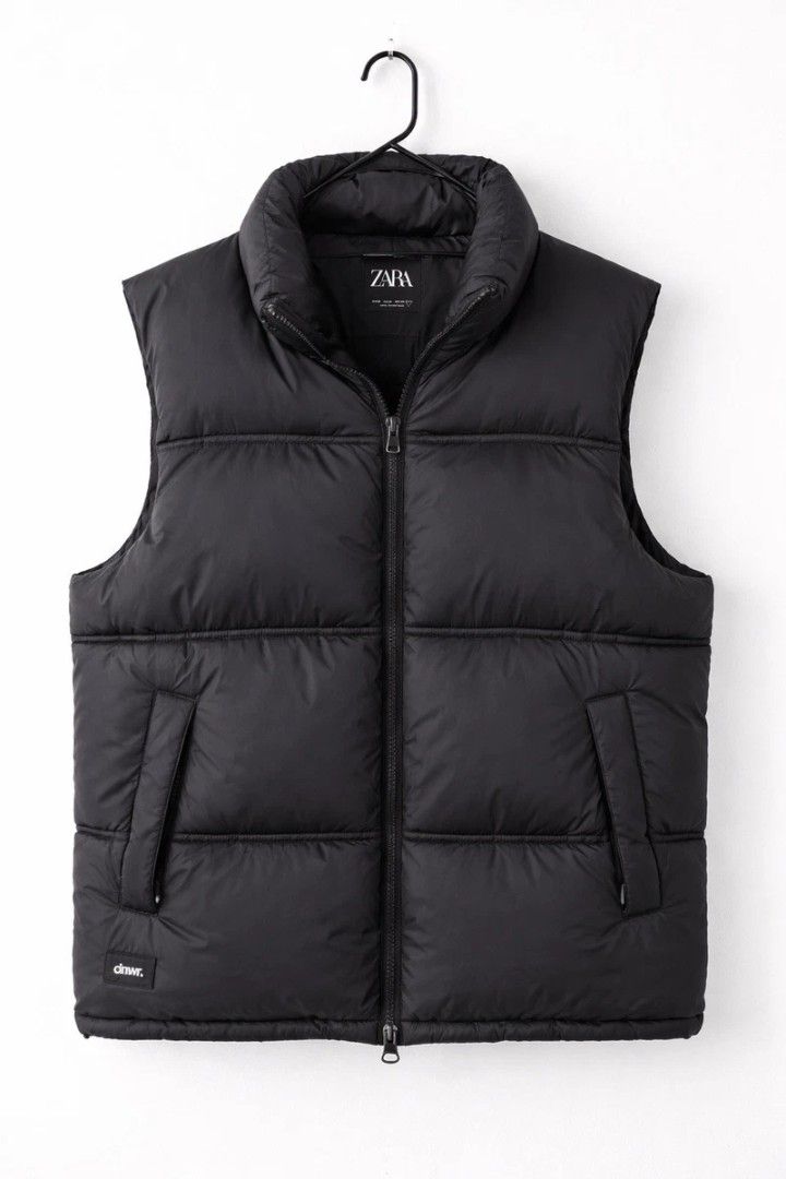 Zara Black Puffer Vest DNWR (Category: Vests) located in Manila. Submitted by cannabino (Listing ID 1467589471, Image 1). Description: - Brand: Zara Denim Wear - Size: XL - Color: Black - Style: Quilted puffer vest with stand collar and full zip front closure - Details: Dual front pockets and subtle 'dnwr' patch near the hem - Condition: Good, perfect for cooler weather layering - Mode of Payment: GCash, Maya, or bank transfer - Shipping: Via J&T