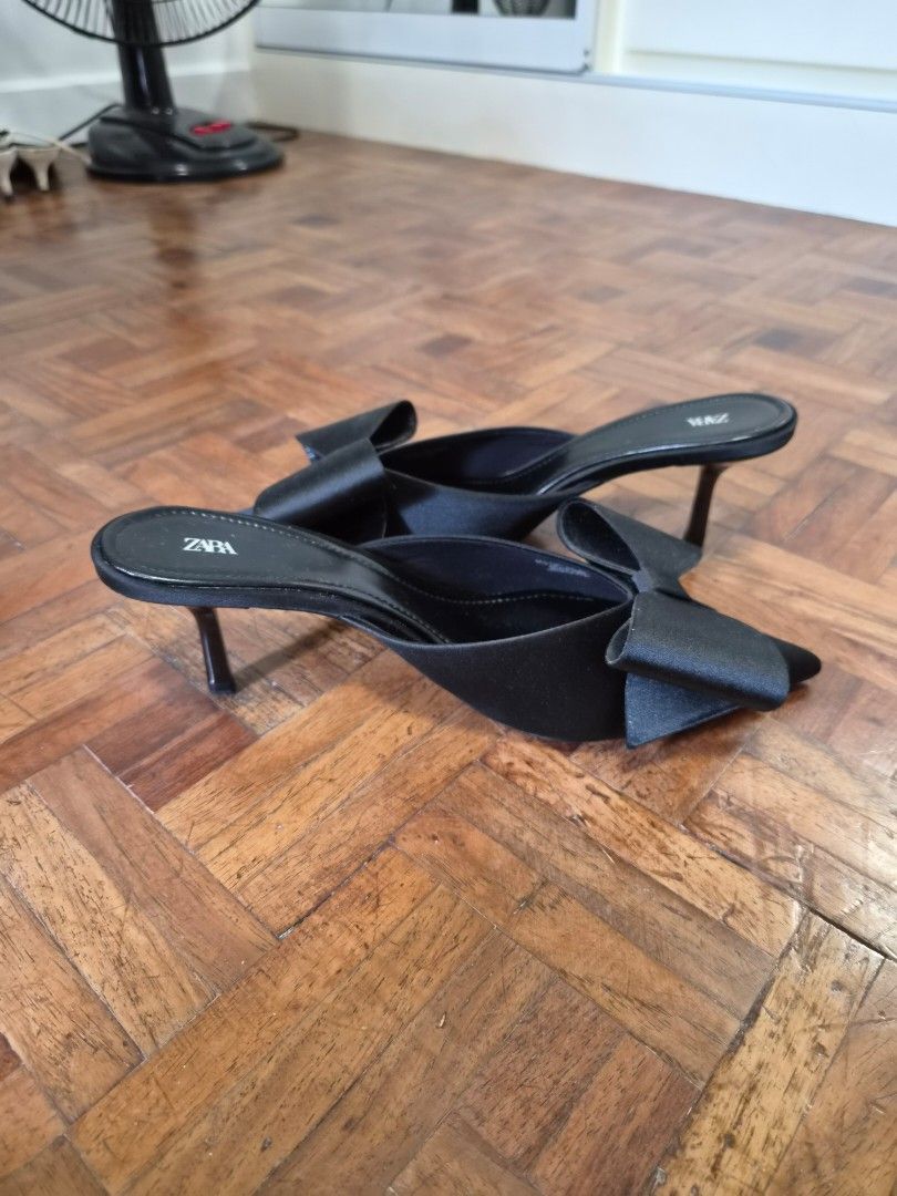Zara Black Satin Bow Pointed Toe Mules Size EUR 39 (Category: Heels) located in Quezon City. Submitted by ShopPDplusK (Listing ID 1467421721, Image 3). Description: - Brand: Zara - Style: Slip-on kitten heel mules - Color: Black - Material: Satin - Size: EUR 39 - Design Details: Chic pointed toe with a large statement bow on the front - Condition: Excellent, minor scuffing on soles from indoor try-ons only.