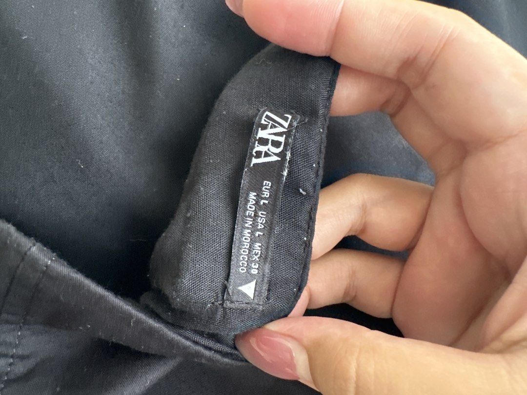 Zara Black Strapless Cargo Jumpsuit Size L (Category: Jumpsuits) located in Taguig. Submitted by anarinamizu (Listing ID 1467426986, Image 3). Description: - Brand: Zara - Style: Strapless cargo jumpsuit with side leg pockets - Fit: Fitted bodice with straight leg trousers - Size: Large - Origin: Made in Morocco - Condition: Great basic piece, easily dressed up or down - Meetups and shipping available - Message for inquiries.