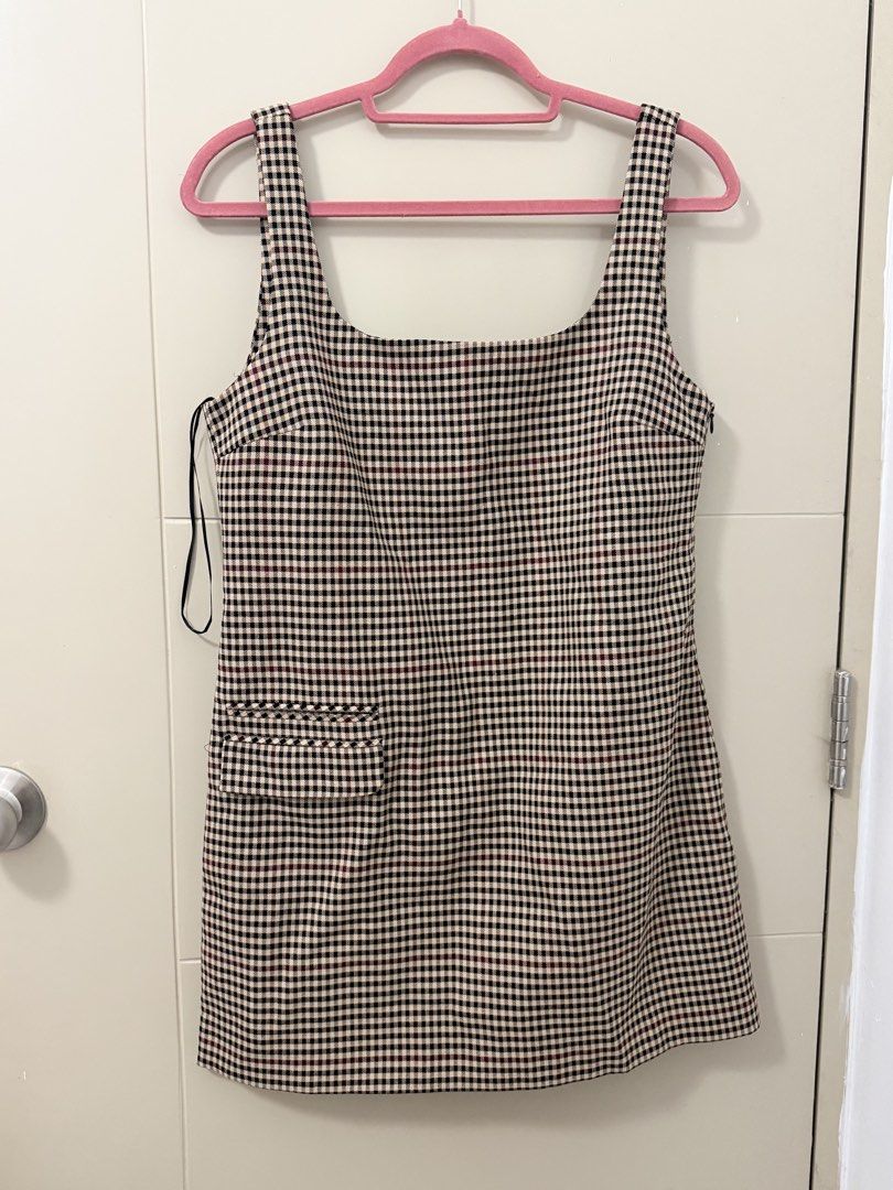 Zara Checkered Plaid Mini Dress Size M (Category: Dresses) located in Quezon City. Submitted by 8s_closet (Listing ID 1467464415, Image 1). Description: - Brand: Zara - Style: Checkered plaid mini dress - Colorway: Black, beige, and dark red - Features: Square neckline, thick straps, and small front pocket detail near hem - Size: Medium (M) - Condition: Brand new with tags (BNWT) including original retail price.