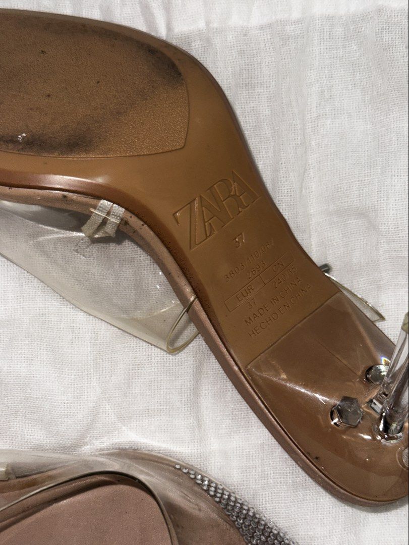 Zara Clear Rhinestone Pointed Toe Slingback Heels Size 37 (Category: Heels) located in Malolos. Submitted by josaruby (Listing ID 1467402966, Image 3). Description: - Brand: Zara - Style: Slingback heels with stiletto heel and adjustable buckle ankle strap - Material: Nude and clear vinyl - Details: Pointed toe covered in sparkling rhinestones - Size: EU 37 - Inclusion: Original Zara dust bag - Condition: Excellent, like new - Needs cleaning, wip