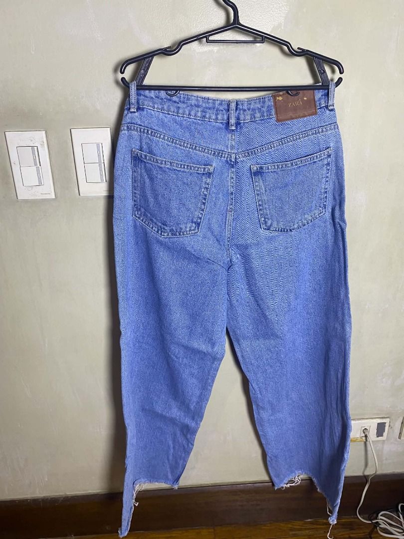 Zara Denim Jeans Light Blue Size S (Category: Jeans) located in Quezon City. Submitted by ultra_seller (Listing ID 1467373561, Image 2). Description: Brand: ZARA Size: EU 36 / US 4 Color: Medium-wash blue denim with visible fading. Cut: Appears to be a relaxed straight-leg silhouette. Hems: Both legs have raw, frayed edges. These may be intentional, altered, or worn. Fabric: Denim texture looks reasonably intact, with no obvious large holes or ma
