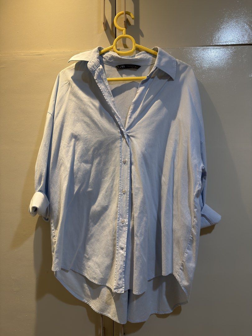 Zara light blue button-down oversized shirt (Category: Longsleeves) located in Las Pinas. Submitted by morenascloset (Listing ID 1467379561, Image 2). Description: Two items for 800 pesos! Green top: Uniqlo Button Down Top: Zara Rfs: Decluttering .