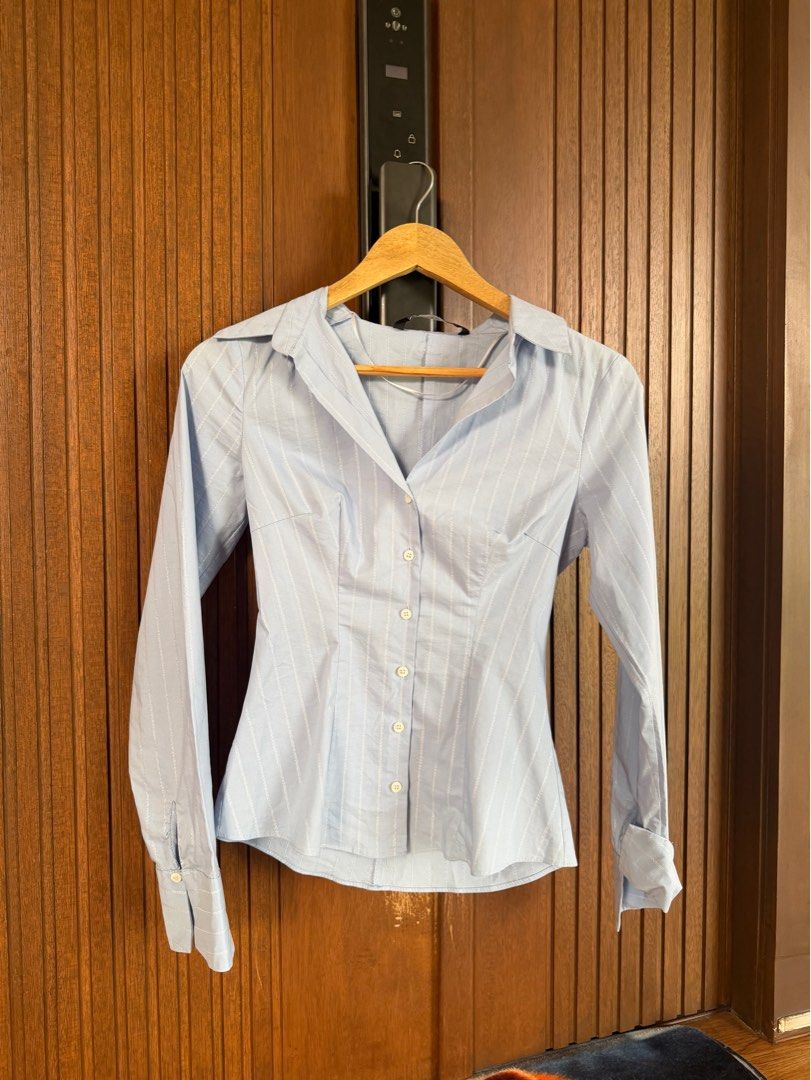 Zara Metallic Thread Striped Fitted Shirt (Category: Shirts) located in Quezon City. Submitted by morgan_rysblk (Listing ID 1467367738, Image 1). Description: - Brand: Zara - Color: Light blue with vertical metallic thread stripes - Size: XS - Love this! Too small na for me - Used once for school travel.