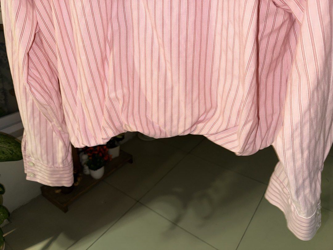 Zara Pink Striped Long Sleeve Button-Down Shirt (Category: Longsleeves) located in Manila. Submitted by clalala.fire (Listing ID 1467528021, Image 2). Description: - Brand: Zara - Size: EUR L / USA L - Color/Pattern: Pink with red and white vertical stripes - Details: Long sleeves with button cuffs, classic collar, and gathered elastic hem - Material: Lightweight cotton.