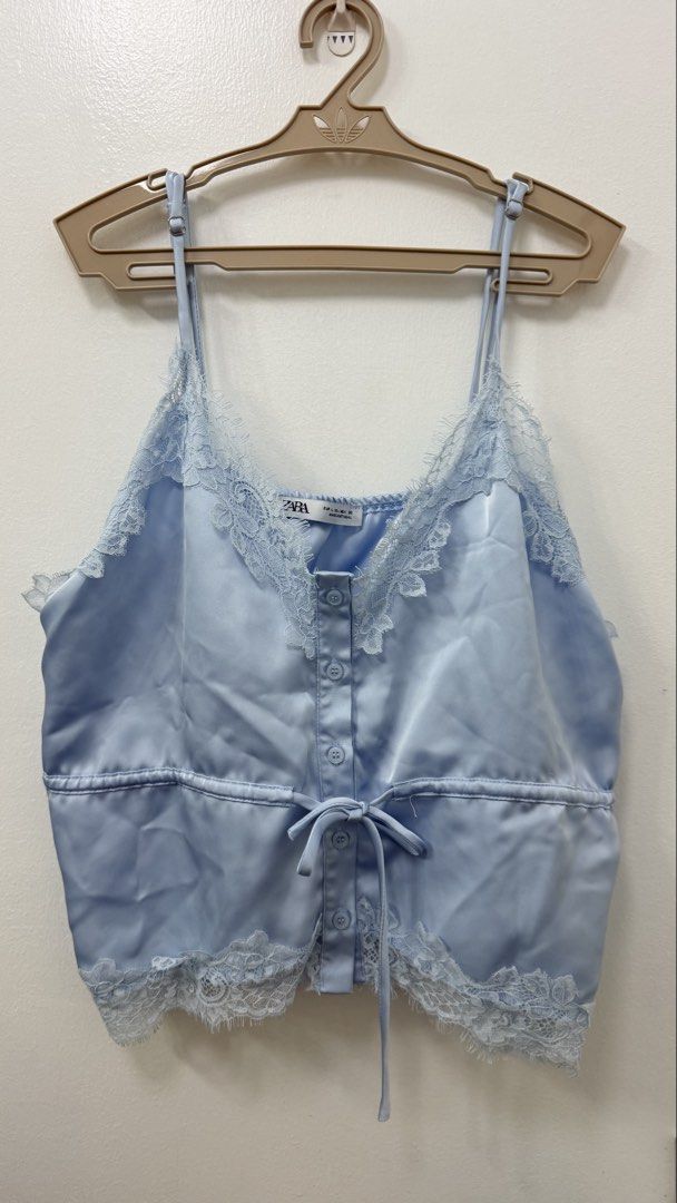 Zara satin top (Category: Blouses) located in Manila. Submitted by ksunbeams (Listing ID 1467471828, Image 1). Description: Zara baby blue satin top 🩵 🌀Like new (once used only)! 🌀 Fits M-L (adjustable) 🌀 Negotiable!! 🌀 Dm for when worn .