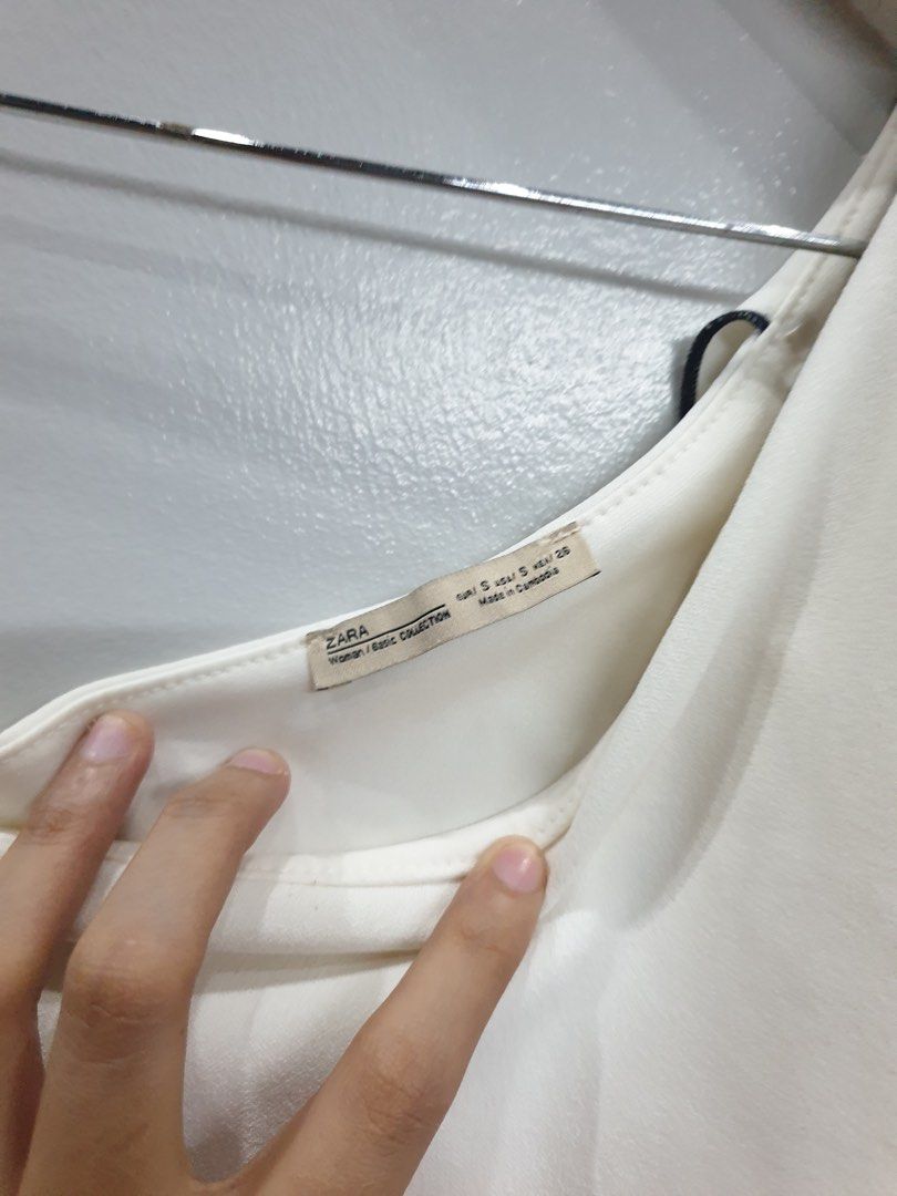 Zara white one-shoulder asymmetrical crop top (Category: Others Tops) located in Calamba. Submitted by mimabuy (Listing ID 1467389026, Image 2). Description: Super pretty! Small on tag but can still fit medium frames Honest Issue: one small dot at the back check last pic for reference Other than that it’s still in good condition .