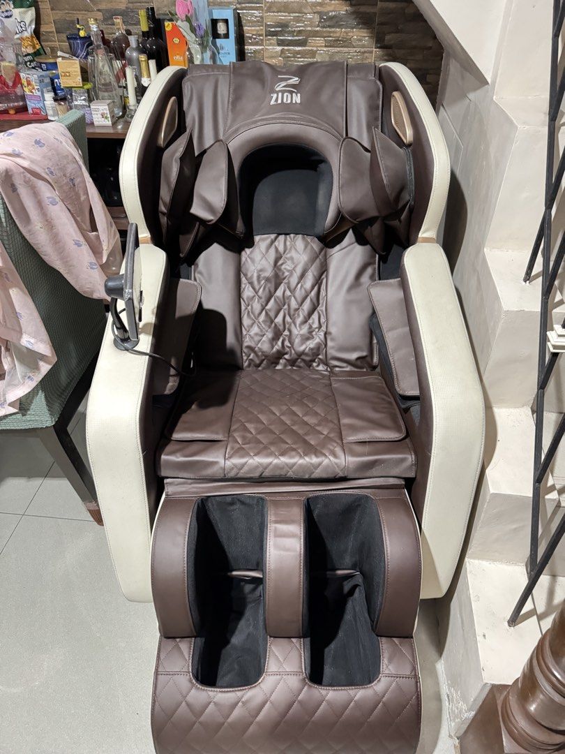 Zion Electric Full Body Massage Chair with Controller (Category: Massage Devices) located in Caloocan City. Submitted by btstlannjie (Listing ID 1467601121, Image 3). Description: - Zion Full Body Massage Chair in premium brown and cream leatherette - Stylish quilted diamond pattern on backrest and seat - Multiple massage modes: kneading, zero gravity, and air pressure for shoulders, arms, and legs - Built-in lower foot massager - Digital control