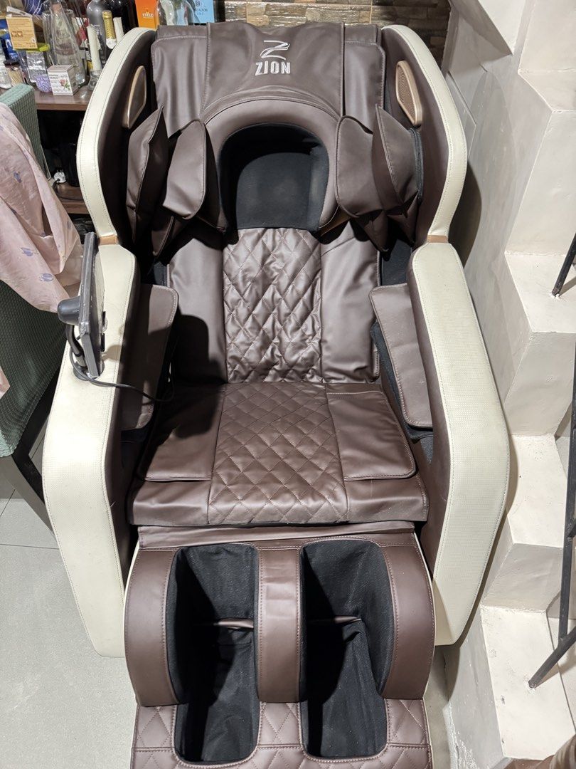Zion Electric Full Body Massage Chair with Controller (Category: Massage Devices) located in Caloocan City. Submitted by btstlannjie (Listing ID 1467601121, Image 2). Description: - Zion Full Body Massage Chair in premium brown and cream leatherette - Stylish quilted diamond pattern on backrest and seat - Multiple massage modes: kneading, zero gravity, and air pressure for shoulders, arms, and legs - Built-in lower foot massager - Digital control