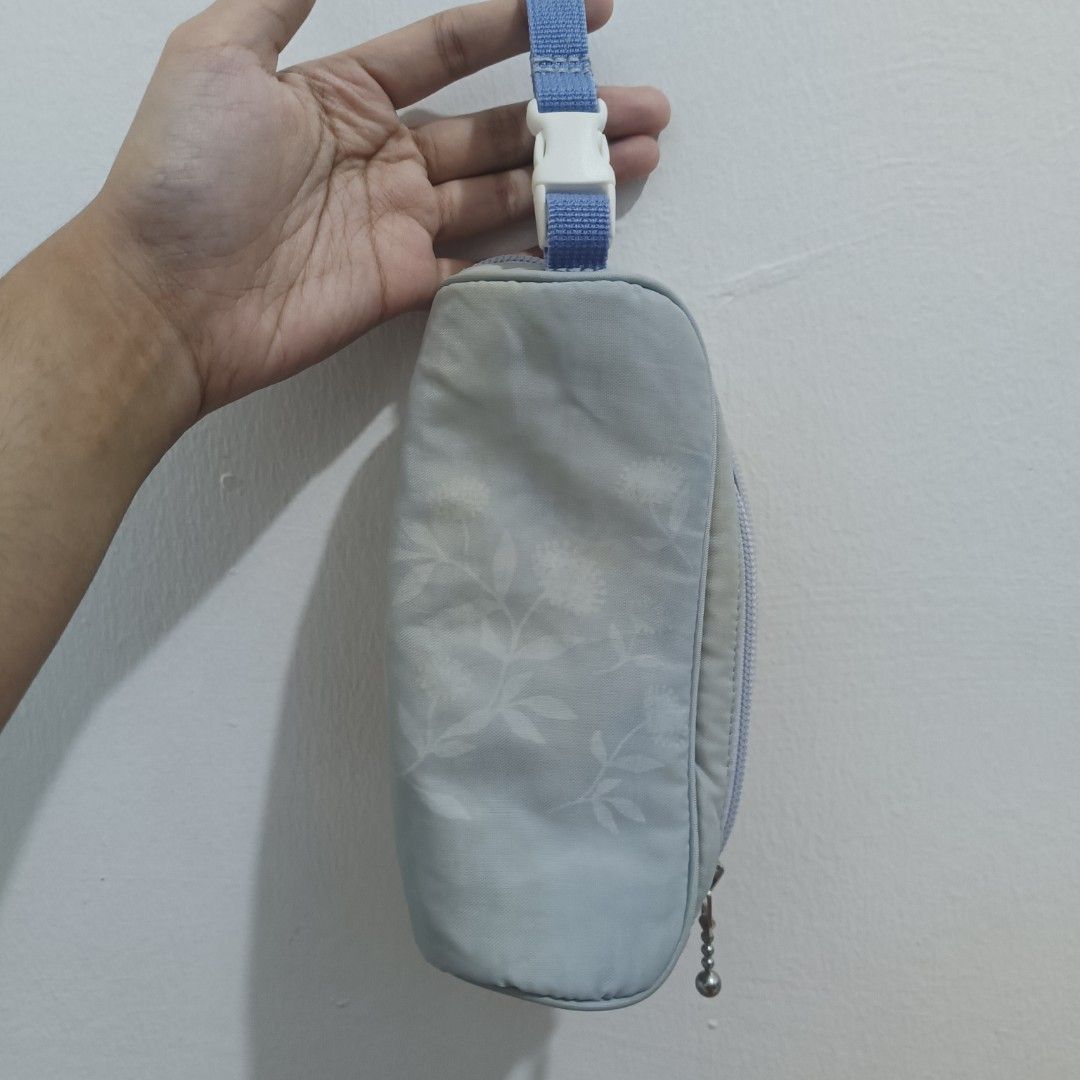 Zojirushi Water Bottle Pouch Holder (Category: Travel Essentials & Accessories) located in Manila. Submitted by thearosete (Listing ID 1467561135, Image 1). Description: - Authentic Zojirushi bottle pouch - Light blue with floral pattern - Clean interior lining - Pre-loved with minor stains - Good as new only needs wash mop: gcash mod: j&t (buyer shoulders sf).
