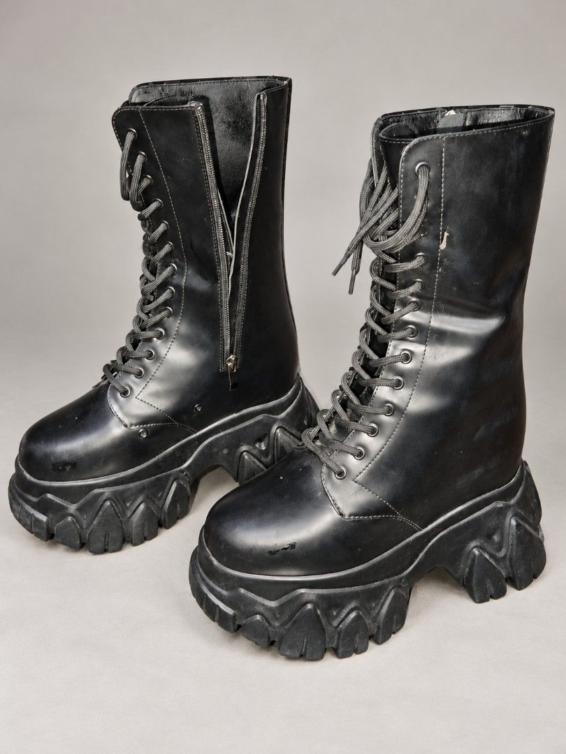 20cm Boots (Category: Boots) located in Manila. Submitted by ckristenr88297 (Listing ID 1467735976, Image 1). Description: - Brand/Model: Xiaodouzi 601 - Size: 40.5 - Color: Black - Style: Goth, alternative, chunky platform boots with heavy lug soles - Features: Lace-up fronts and convenient side zippers - Condition: Pre-loved with minor scuffs on the toe and some flaking on the inner lining near the collar.