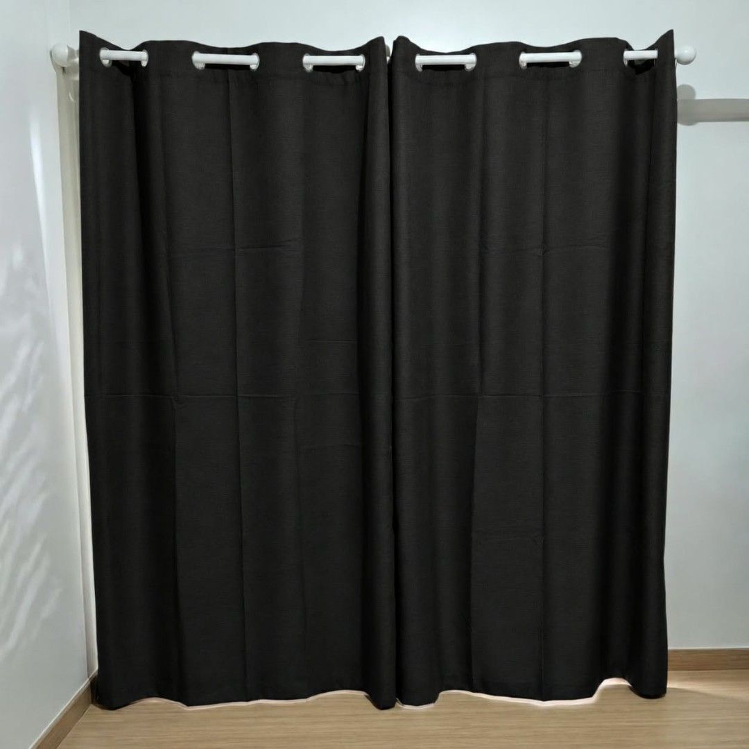 4pcs 7ft Black Blackout Curtains (Category: Curtains & Blinds) located in Quezon City. Submitted by reply_1982 (Listing ID 1467838942, Image 1). Description: - Color: Solid black - Design: Ring top for easy hanging - Material: Blocks light effectively - Compatibility: Fits standard curtain rods; neutral style fits bedrooms and living rooms - Sold as a 2 pairs of panels (4pcs).
