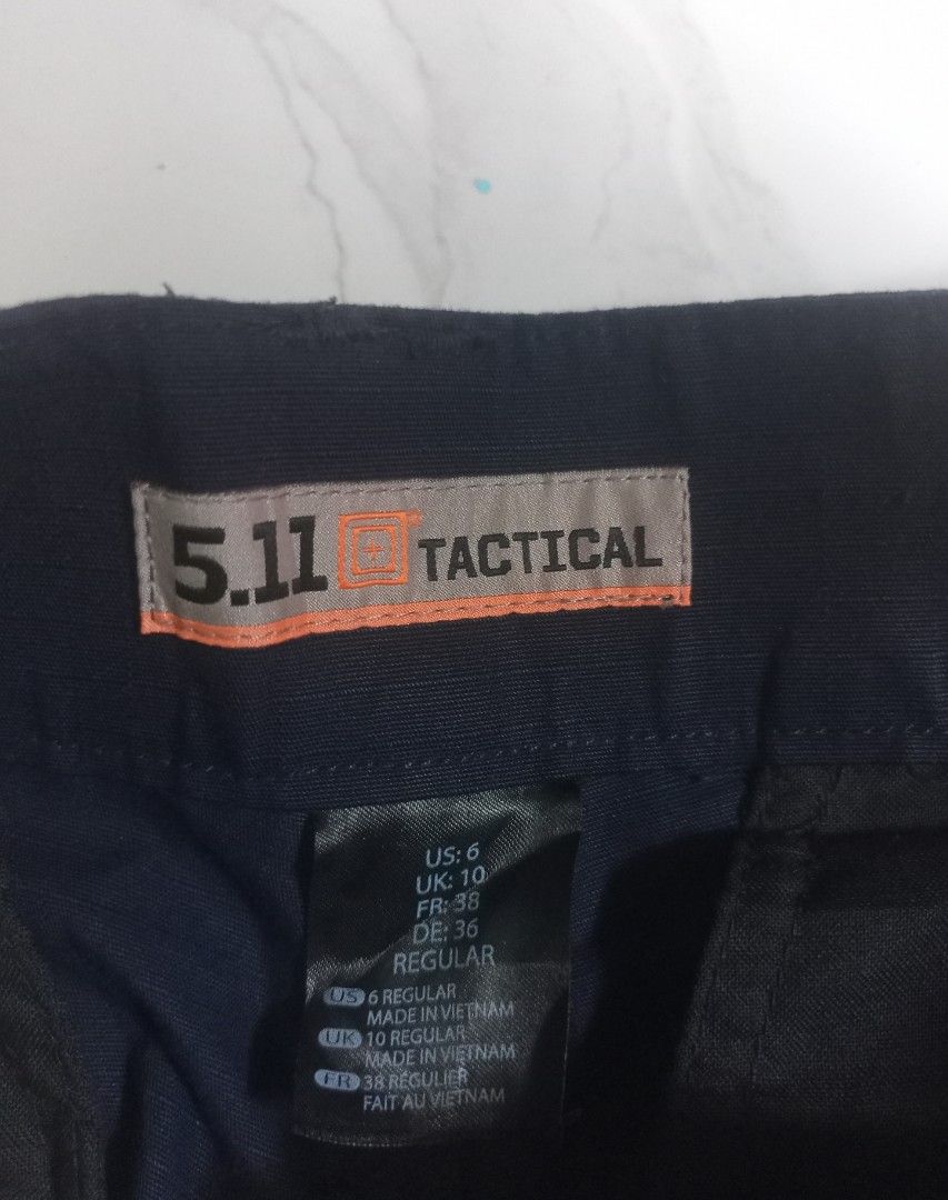 5.11 Tactical Cargo Pants US 6 Regular size 31 (Category: Trousers) located in Taguig. Submitted by mvdsh0p2022 (Listing ID 1467615037, Image 1). Description: - Brand/Model: 5.11 Tactical Cargo Pants - Color: Black - Size: US 6 Regular / UK 10 / FR 38 / DE 36 - Material: 65% Polyester, 35% Cotton (Durable Ripstop Fabric) - Origin: Made in Vietnam - Condition: Clean inside and out - Features: Multiple utility pockets, ideal for outdoor use or work