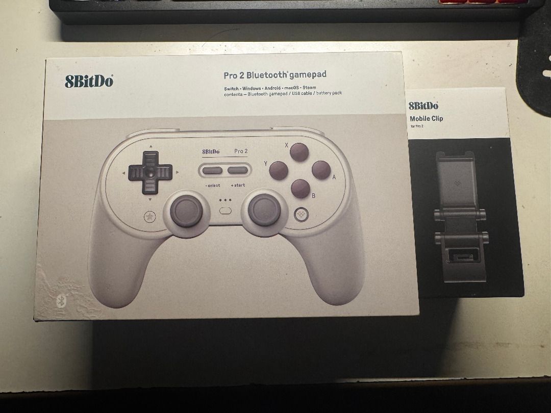8BitDo Pro 2 Bluetooth Controller with Phone Clip (Category: Controllers) located in Marilao. Submitted by miguelsanti (Listing ID 1467667706, Image 2). Description: - 8BitDo Pro 2 Bluetooth Gamepad - Accessories included: Original box packaging and type c cable - Green thumbstick grips and phone clip included - Condition/Inclusions: Everything pictured is included, well-maintained and ready to use Bought originally for ₱2,000 No longer being use