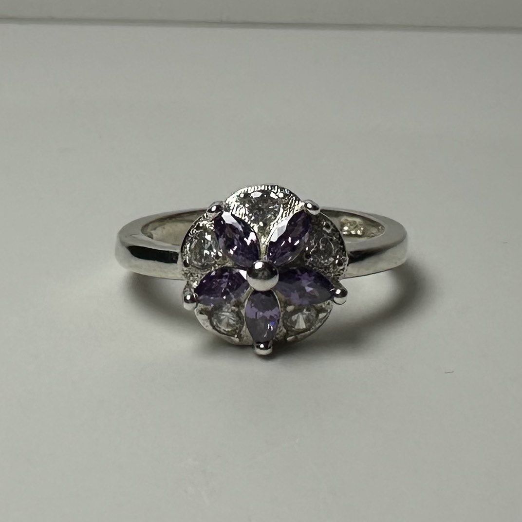 925 silver flower ring with purple stone 2.5g (Category: Rings) located in Pakil. Submitted by primrosehearts (Listing ID 1467780422, Image 3). Description: authentic 925 italy silver with stamping hypoallergenic size: 5.5 grams: 2.5g.