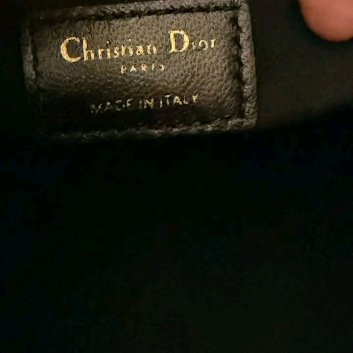 💢 Christian Dior Medium Essential Tote Bag (Category: Luxury Bags & Wallets) located in Kibawe. Submitted by yumicaspia39544 (Listing ID 1467637572, Image 3). Description: Christian Dior Medium Essential Tote Bag 13,999 plus sf Genuine soft leather Like new/ Brandnew This is CHRISTIAN DIOR Calfskin Archicannage Medium Essential Tote in Black. This bag is crafted of quilted black calfskin leather and gold hardware. The top opens to a black suede 