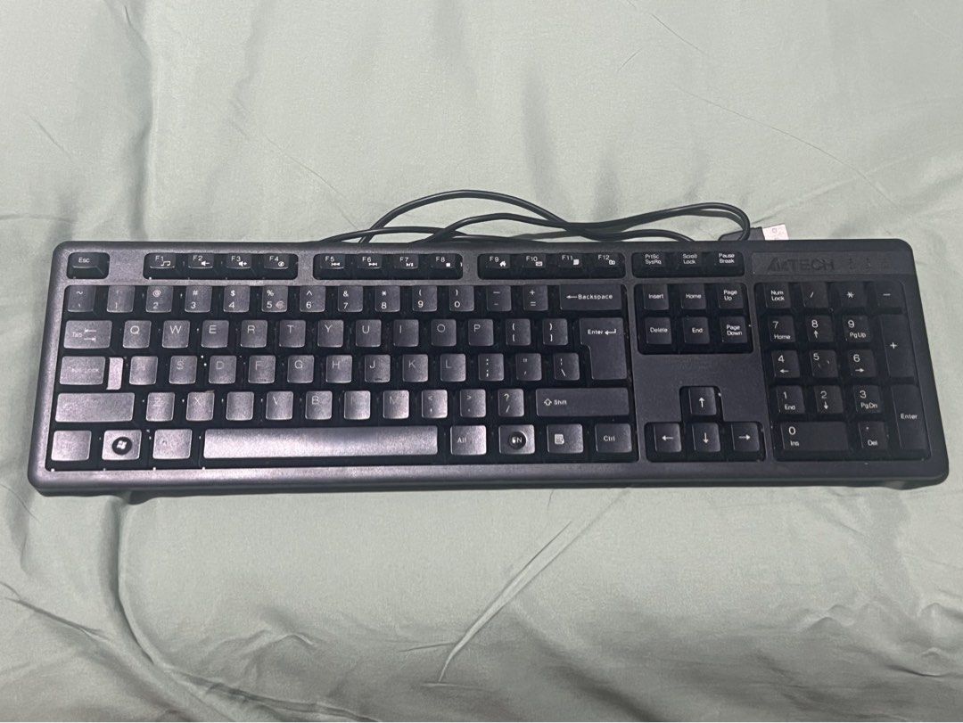 A4TECH Wired Keyboard with Numeric Keypad (Category: Computer Keyboard) located in Manila. Submitted by pao_potato21 (Listing ID 1467822361, Image 1). Description: - Brand: A4Tech - Type: Wired keyboard with USB connection - Layout: Full-size QWERTY with dedicated numeric keypad and function keys - Condition: Clean, well-maintained, with clear key markings - Perfect for office work, study, or everyday desktop setup - Plug and play, ready to use.