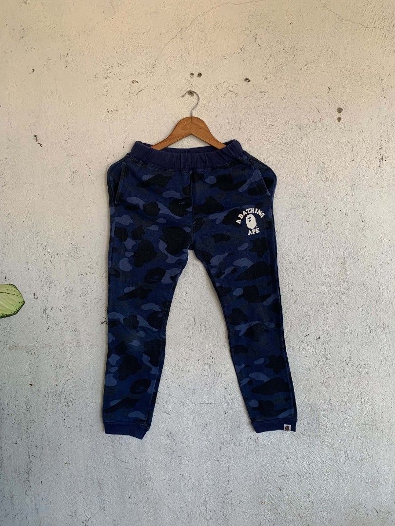 A Bathing Ape BAPE Blue Camo Sweatpants (Category: Babies & Kids Fashion) located in Manila. Submitted by louiseluch69680 (Listing ID 1467652805, Image 1). Description: Bape sweatpants excellent condition no issue Size 150 fit to 11-12 years old dimes 22x33.5 ✅authentic .