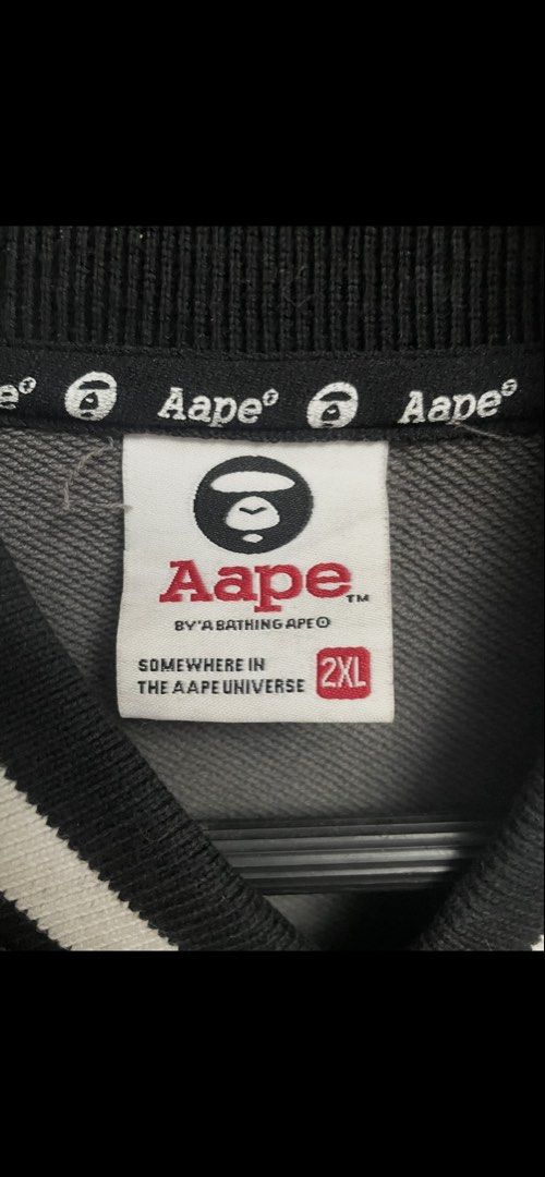 Aape varsity jacket camou (Category: Activewear) located in Lipa City. Submitted by thriftpingssss (Listing ID 1467630624, Image 2). Description: Issue: pinhole not noticeable 21x27 9/10 overall condi.