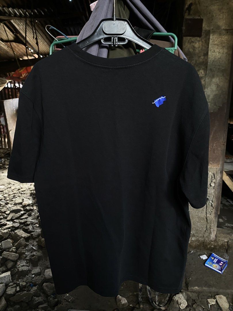 Ader Error Black T-Shirt Size A2 (Category: Tshirts & Polo Shirts ) located in San Fernando. Submitted by thrifteezy6 (Listing ID 1467663839, Image 2). Description: - Brand: Ader Error (2021 Spring/Summer Collection) - Color: Solid Black with bold blue graphic logo on chest - Size: A2 (Regular Fit) - Material: 84% Cotton, 16% Polyester - Details: Features iconic blue tag emblem on the back - Condition: Clean, tags shown in photos - Guaranteed aut