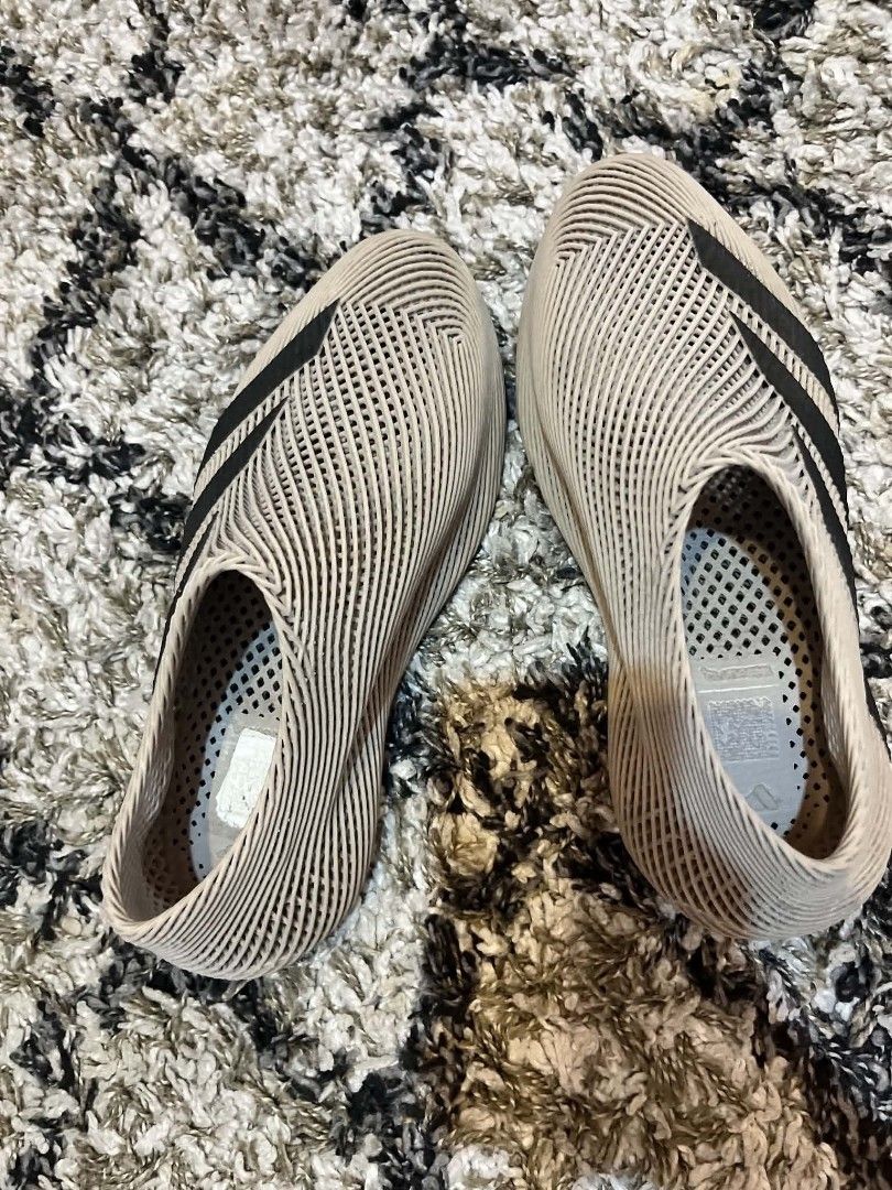 Adidas 3D Printed Slip-On Sneakers (Category: Sneakers) located in Antipolo. Submitted by tikboy5112 (Listing ID 1467732571, Image 1). Description: - Brand: Adidas - Color: Beige with black three stripes - Design: Futuristic 3D printed open lattice structure - Fit: Slip-on with no laces needed - Weight: Extremely lightweight construction - Condition: Rare find, grab them while available!.