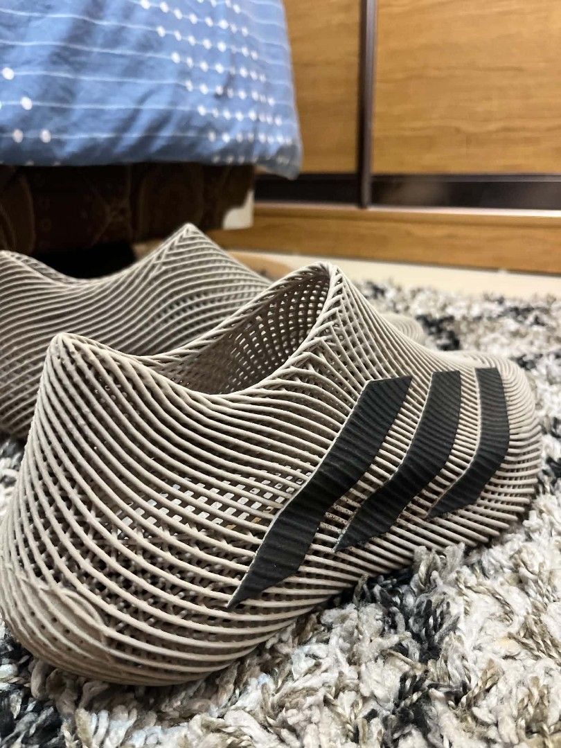 Adidas 3D Printed Slip-On Sneakers (Category: Sneakers) located in Antipolo. Submitted by tikboy5112 (Listing ID 1467732571, Image 2). Description: - Brand: Adidas - Color: Beige with black three stripes - Design: Futuristic 3D printed open lattice structure - Fit: Slip-on with no laces needed - Weight: Extremely lightweight construction - Condition: Rare find, grab them while available!.