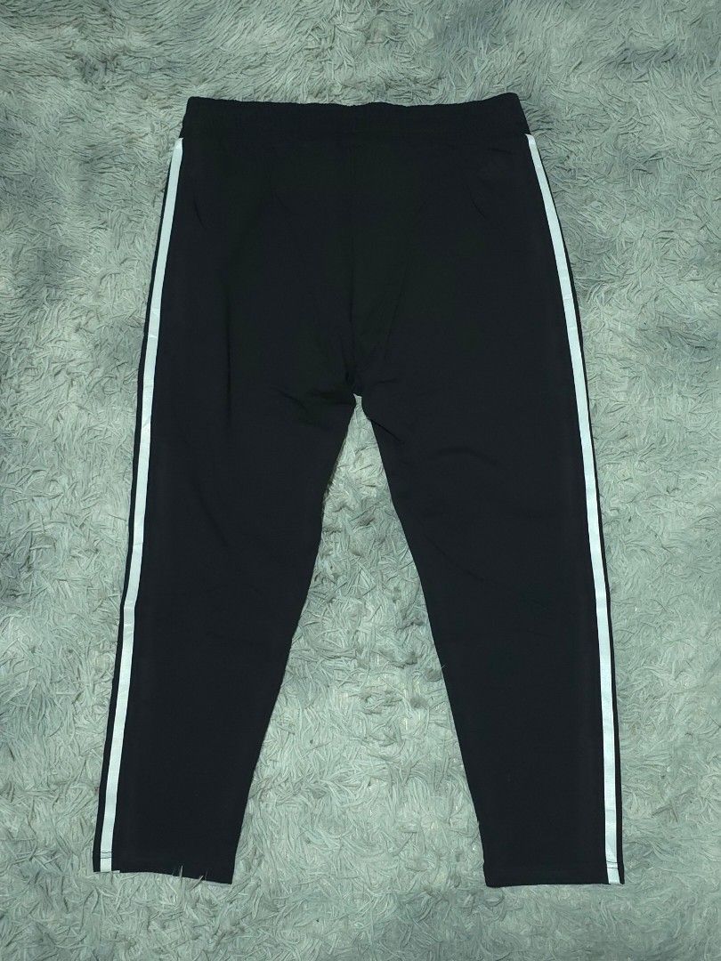 Adidas Black Track Pants with White Stripes (Category: Joggers) located in Abulug. Submitted by humanwhosellthings (Listing ID 1467636687, Image 2). Description: ADI Jogger Pants ✅Excellent Condition ✅Issue: none ▫️Waist Size: 30-36 ▫️Length: 32 - Color: Classic black with bold white side stripes - Branding: Subtle black Adidas logo embroidery near the pocket - Fit: Secure drawstring waist for adjustable comfort - Storage: Convenient zip pockets 