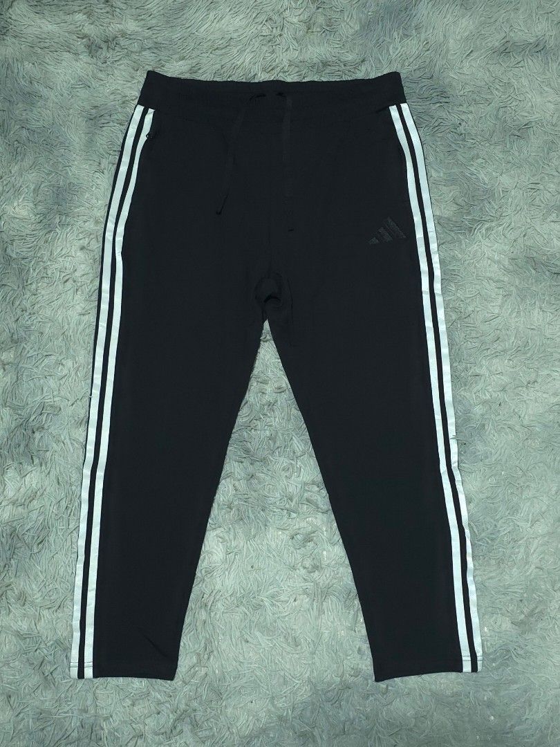 Adidas Black Track Pants with White Stripes (Category: Joggers) located in Abulug. Submitted by humanwhosellthings (Listing ID 1467636687, Image 1). Description: ADI Jogger Pants ✅Excellent Condition ✅Issue: none ▫️Waist Size: 30-36 ▫️Length: 32 - Color: Classic black with bold white side stripes - Branding: Subtle black Adidas logo embroidery near the pocket - Fit: Secure drawstring waist for adjustable comfort - Storage: Convenient zip pockets 