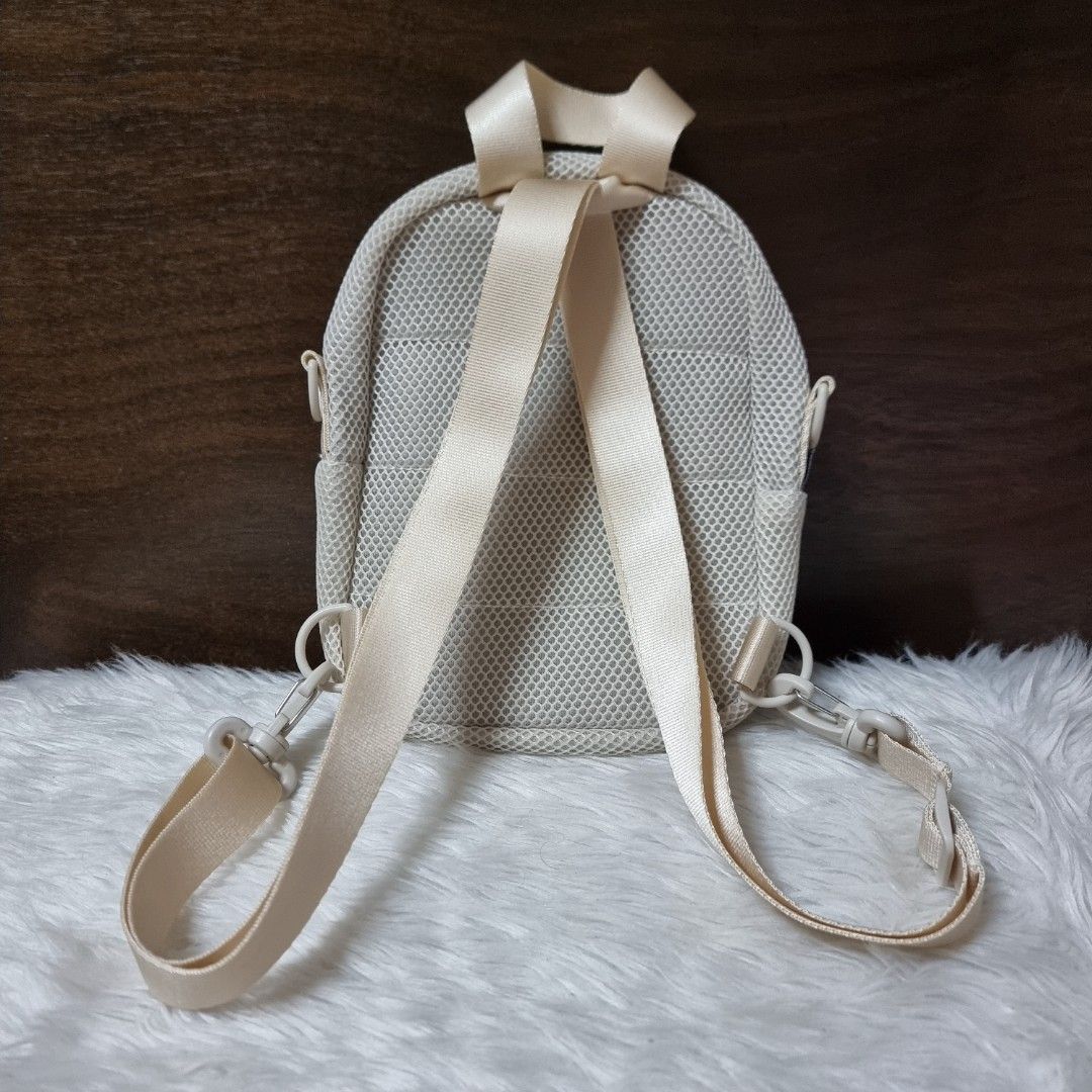 Adidas Cream Mesh Mini Backpack Crossbody Bag (Category: Backpacks) located in Manila. Submitted by fashiondera. (Listing ID 1467644272, Image 2). Description: - Brand: Adidas - Color: Cream - Style: Mini backpack / Convertible crossbody - Material: Mesh texture outer shell - Features: Main zipper compartment, front pocket, inner slip pocket, top handle - Straps: Adjustable and versatile for multiple wear styles - Condition: Clean interior lining