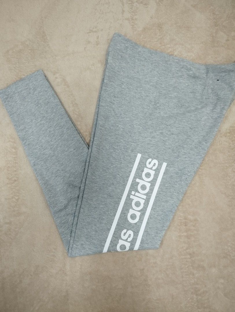 Adidas grey cotton leggings size S (Category: Activewear) located in Dagupan City. Submitted by nahamul_1508 (Listing ID 1467648066, Image 1). Description: Preloved #9 - Brand: Adidas - Color: Grey with large white vertical branding - Size: Small (S) - Material: Comfortable Climalite fabric - Features: Elastic waistband - Length: Approx. 36 inches total - Origin: Made in Pakistan - Condition: Excellent for workouts or daily lounging.