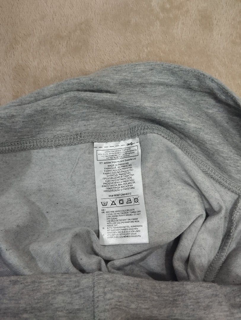 Adidas grey cotton leggings size S (Category: Activewear) located in Dagupan City. Submitted by nahamul_1508 (Listing ID 1467648066, Image 3). Description: Preloved #9 - Brand: Adidas - Color: Grey with large white vertical branding - Size: Small (S) - Material: Comfortable Climalite fabric - Features: Elastic waistband - Length: Approx. 36 inches total - Origin: Made in Pakistan - Condition: Excellent for workouts or daily lounging.