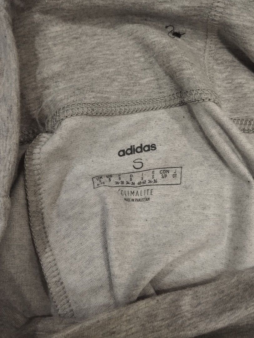 Adidas grey cotton leggings size S (Category: Activewear) located in Dagupan City. Submitted by nahamul_1508 (Listing ID 1467648066, Image 2). Description: Preloved #9 - Brand: Adidas - Color: Grey with large white vertical branding - Size: Small (S) - Material: Comfortable Climalite fabric - Features: Elastic waistband - Length: Approx. 36 inches total - Origin: Made in Pakistan - Condition: Excellent for workouts or daily lounging.