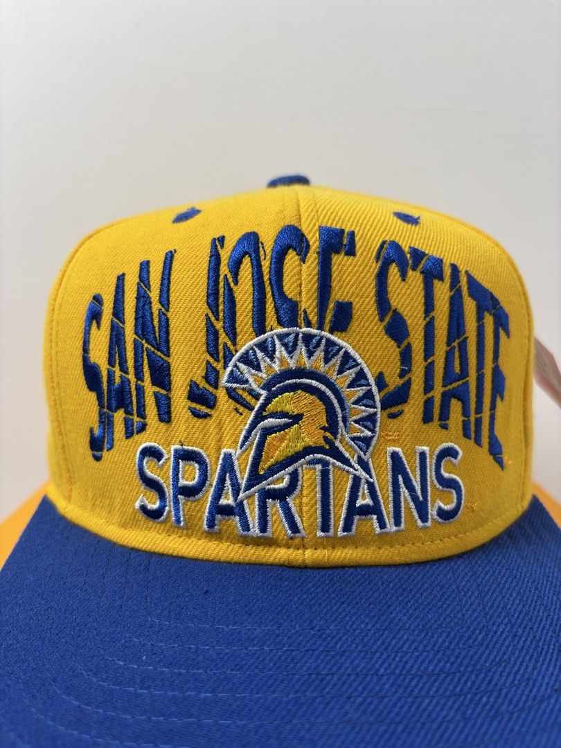 Adidas San Jose State Spartans Snapback Hat (Category: Caps & Hats) located in Marikina City. Submitted by zaxcheus_castillo1708 (Listing ID 1467654456, Image 2). Description: - Brand: Adidas - Team: San Jose State Spartans - Design: Yellow cap with blue brim, top button, and adjustable snap closure - Details: Large team embroidery on front, white Adidas trefoil logo on back - Material: 80% acrylic, 20% wool blend - Origin: Made in Bangladesh - S