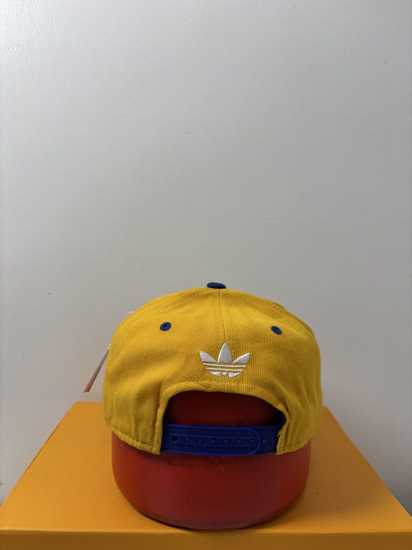 Adidas San Jose State Spartans Snapback Hat (Category: Caps & Hats) located in Marikina City. Submitted by zaxcheus_castillo1708 (Listing ID 1467654456, Image 3). Description: - Brand: Adidas - Team: San Jose State Spartans - Design: Yellow cap with blue brim, top button, and adjustable snap closure - Details: Large team embroidery on front, white Adidas trefoil logo on back - Material: 80% acrylic, 20% wool blend - Origin: Made in Bangladesh - S