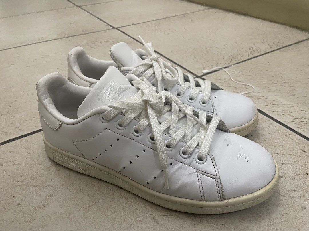 Adidas Stan Smith Triple White (Category: Casual Shoes) located in Manila. Submitted by kennethv (Listing ID 1467810333, Image 1). Description: - Brand: Adidas - Model: Stan Smith - Color: White/White - Material: Premium leather upper - Design: Iconic perforated three stripes and signature Stan Smith tongue portrait - Sole: Durable matching white sole with embossed branding - Fit: Low-top silhouette with comfortable collar padding - Condition: Br