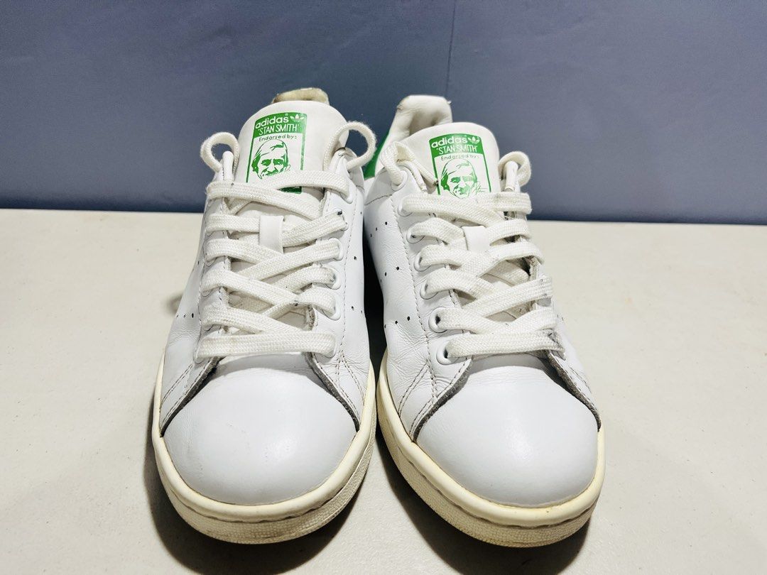 Adidas Stan Smith White Green Sneakers (Category: Sneakers) located in Manila. Submitted by zar0408 (Listing ID 1467744867, Image 1). Description: - Brand: Adidas - Model: Stan Smith - Colorway: White and Green - Upper: Clean white leather with iconic perforated three stripes - Details: Green heel patch with white trefoil logo, Stan Smith portrait on the tongue - Sole: Off-white midsoles with standard lace-up closure - Condition: lightly used(rea