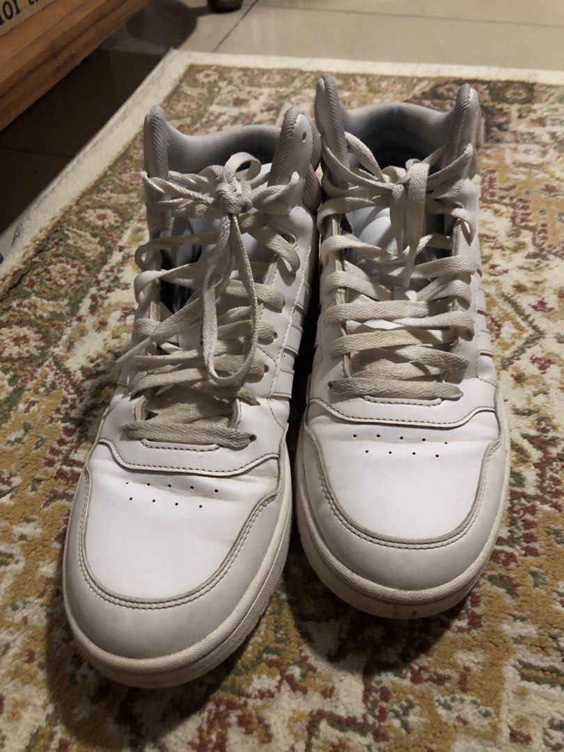 Adidas White High-Top Sneakers (Category: Sneakers) located in Bacoor. Submitted by meann.sy (Listing ID 1467761281, Image 1). Description: - Authentic white adidas high-top sneakers - Secure lace-up closure with a comfortable padded ankle collar - Classic perforated details on the toe box - Subtle debossed adidas logo on the heel counter - Clean laces included - Soles show minor wear and slight discoloration from regular use.