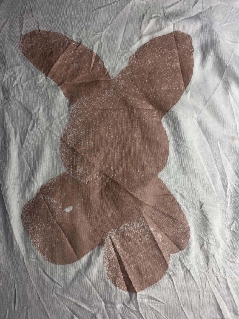ADLV White Graphic T-Shirt Size 1 (Category: Tshirts & Polo Shirts ) located in Ajuy. Submitted by quickcrystal-effaca (Listing ID 1467681708, Image 2). Description: - Brand: Acmé De La Vie (ADLV) - Color: Crisp White - Design: Large pink bunny graphic on the front - Style: Short sleeves, crew neck - Size: Size 1 (ADLV standard sizing) - Details: Official website URL printed on the back collar tag - Condition: Excellent, clean fabric with minimal