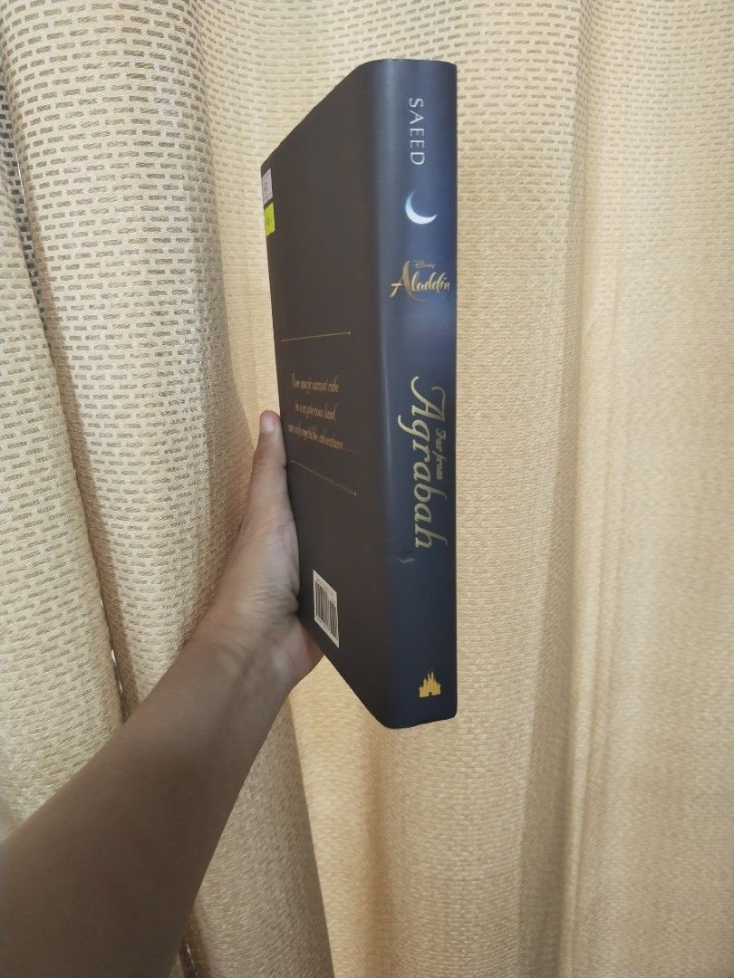 Aladdin: Far from Agrabah by Aisha Saeed (Category: Storybooks) located in Cavite. Submitted by munting_aklatan_ph (Listing ID 1467652269, Image 3). Description: - Title: Official Aladdin Universe Adventure by Aisha Saeed - Format: Hardcover edition - Plot: A brand new adventure with Princess Jasmine and Aladdin beyond the palace walls - Author: New York Times best-selling author - Condition: Preloved as new condition / Great read for Disney fans