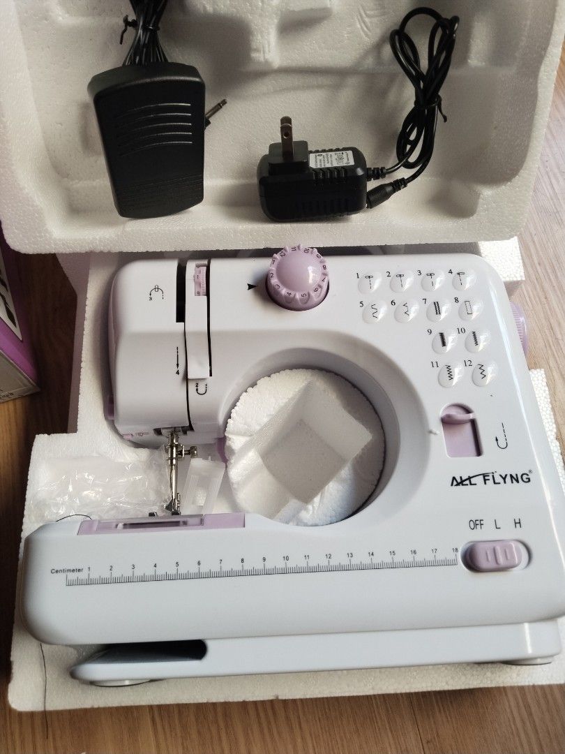 ALL FLYNG Mini Sewing Machine — YASM-505A | Used ONCE Only! (Category: Other Home Appliances) located in Caloocan City. Submitted by purplemomma (Listing ID 1467713123, Image 3). Description: ✨ Like New Condition — Literally used just once! ✨ 📌 Specs: - Model: YASM-505A ​ - 12 built-in stitch patterns ​ - Long-lasting LED light ​ - Reverse sewing function ​ - Bobbin rewinder & drawer included ​ - Interchangeable foot ​ - Dual speed control (Low 