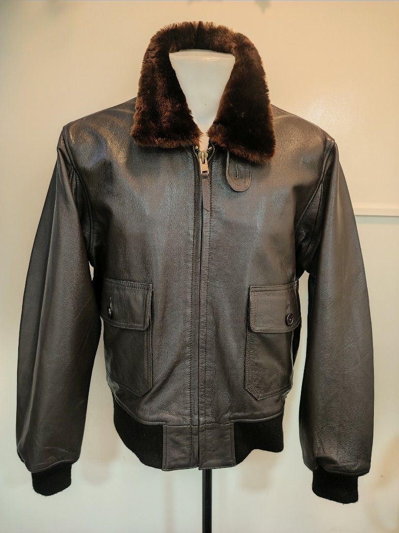 Alpha Industries USN Brown Leather Bomber Jacket (Category: Coats, Jackets and Outerwear) located in La Trinidad. Submitted by padasem_kadi (Listing ID 1467645160, Image 3). Description: - Classic brown leather bomber jacket with a cozy dark brown faux fur collar - Wind-blocking ribbed cuffs and hem for extra warmth - Two front flap pockets with secure button closures and heavy-duty front zip - Measurements: Chest 25", Length 26", Sleeves 26" - C