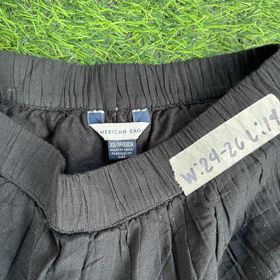 American Eagle Black Tiered Mini Skirt XS (Category: Skirts) located in Cuyapo. Submitted by Ashtyn.Pre.Loved (Listing ID 1467730745, Image 3). Description: Black tiered mini skirt from American Eagle. Features a stretchy elastic waistband with gathered ruffles down the length. Lightweight cotton material with a textured crinkle finish. Size XS on the tag. Measured waist approximately 24 to 26 inches, length around 14 inches. Made in India. Easy 