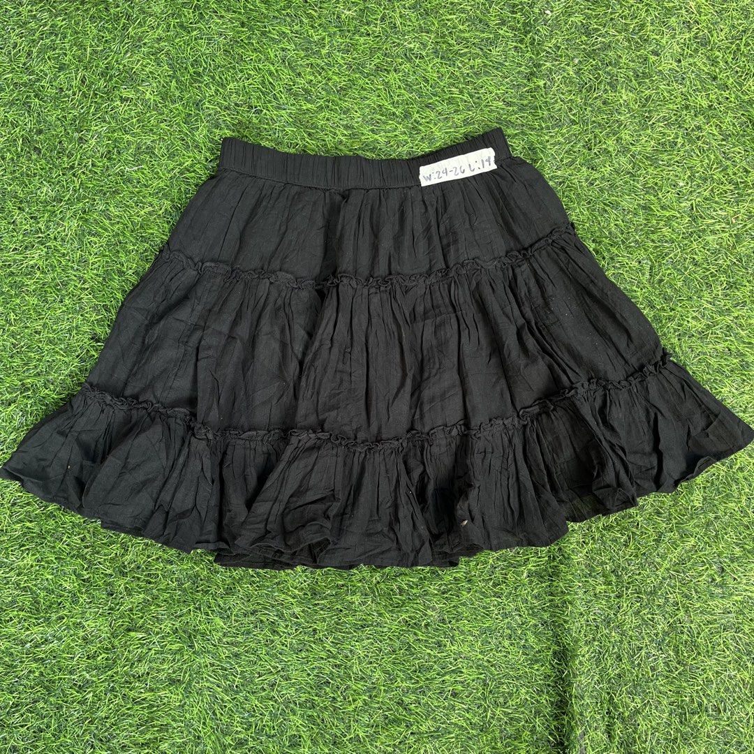 American Eagle Black Tiered Mini Skirt XS (Category: Skirts) located in Cuyapo. Submitted by Ashtyn.Pre.Loved (Listing ID 1467730745, Image 1). Description: Black tiered mini skirt from American Eagle. Features a stretchy elastic waistband with gathered ruffles down the length. Lightweight cotton material with a textured crinkle finish. Size XS on the tag. Measured waist approximately 24 to 26 inches, length around 14 inches. Made in India. Easy 