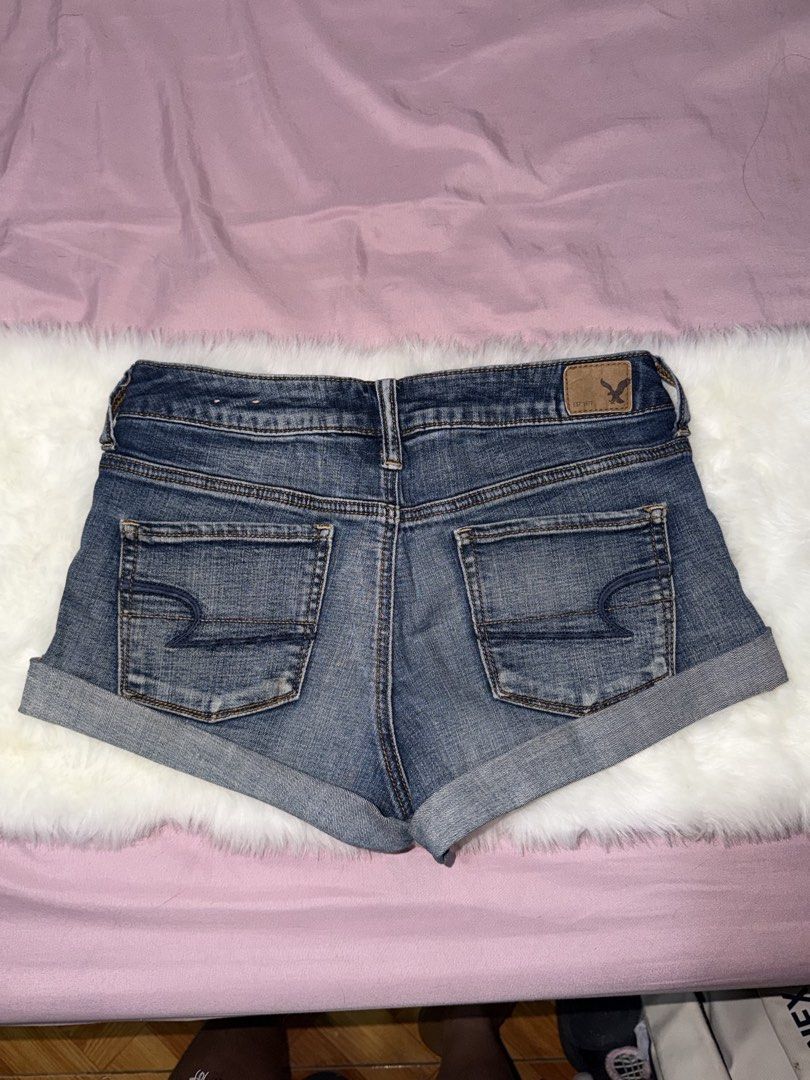 American Eagle Outfitters Denim Shorts (Category: Shorts) located in Manila. Submitted by maureenn10 (Listing ID 1467790819, Image 2). Description: - Brand: American Eagle Outfitters - Style: Denim shorts with rolled cuff hem - Wash: Medium wash - Design: Classic five-pocket style with zip fly and button closure - Details: Signature back pocket stitching and leather brand patch on waistband - Condition: Great basic piece for casual wear.