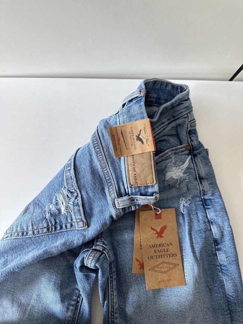 American Eagle Outfitters Distressed Stretch Jeans size 24 (Category: Jeans) located in Manila. Submitted by slayannajayne (Listing ID 1467741652, Image 2). Description: - Brand: American Eagle Outfitters - Condition: Brand new with original paper tags attached - Wash: Light blue with trendy distressed details at knees and pockets - Fit: Slim fit through the legs - Closure: Classic hardware and button closure - Style: Casual, versatile, and comfo