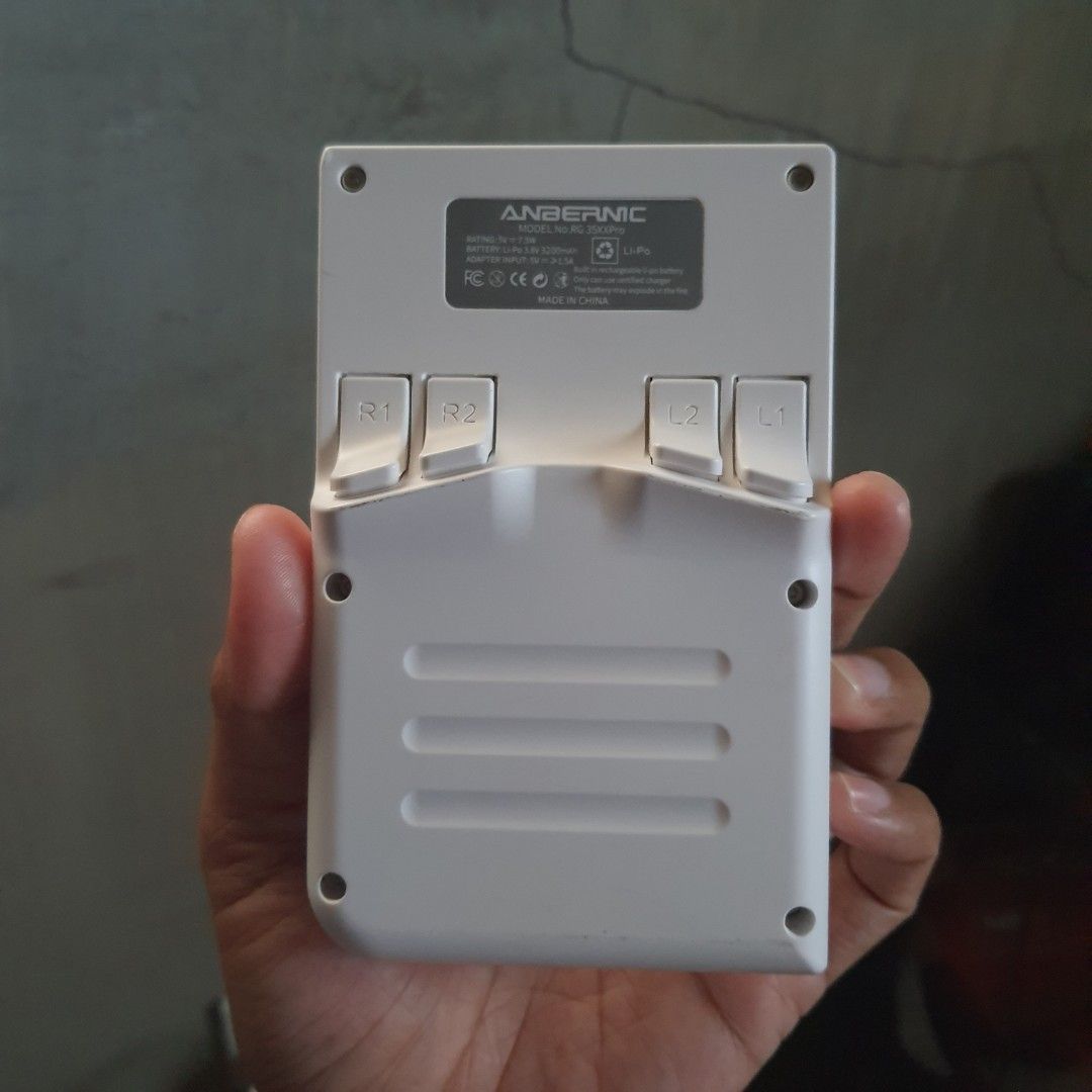 Anbernic RG350X Pro Handheld Game Console (Category: Nintendo) located in Tarlac. Submitted by jajubells (Listing ID 1467614652, Image 2). Description: - Model: Anbernic RG350X Pro Retro Handheld - Color: Clean white plastic casing - Controls: Dual analog sticks, D-pad, face buttons, and rear shoulder triggers - Ports & Slots: Dual TF card slots, USB-C charging port, HDMI output, and headphone jack - Condition: Fully functional, great portable co