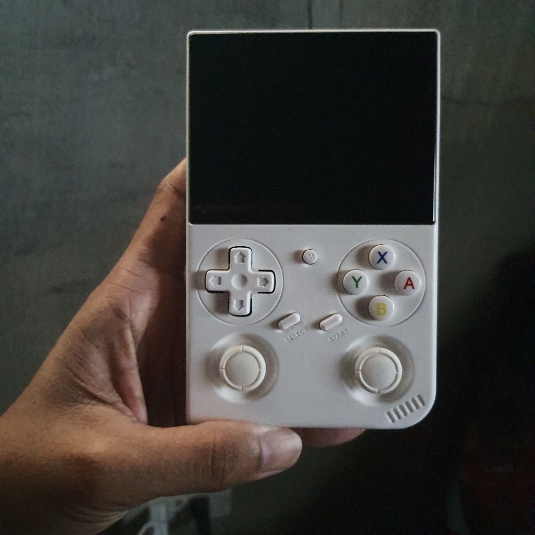 Anbernic RG350X Pro Handheld Game Console (Category: Nintendo) located in Tarlac. Submitted by jajubells (Listing ID 1467614652, Image 1). Description: - Model: Anbernic RG350X Pro Retro Handheld - Color: Clean white plastic casing - Controls: Dual analog sticks, D-pad, face buttons, and rear shoulder triggers - Ports & Slots: Dual TF card slots, USB-C charging port, HDMI output, and headphone jack - Condition: Fully functional, great portable co